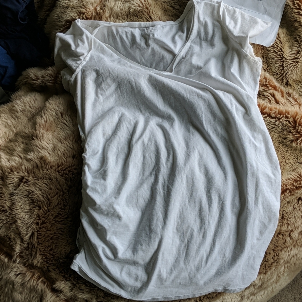 Plain white T-shirt. Worn once. Mother had mater